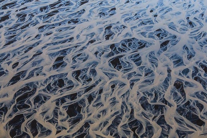 Airplane tour over black sands and riverbeds from Skaftafell